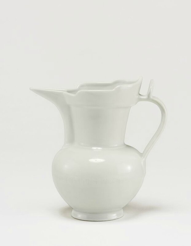 A rare white 'Monk's Cap' ewer incised with tibetan inscription, Ming dynasty, Yongle period