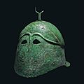 A greek bronze pseudo-corinthian helmet, magna graecia, classical period, circa 5th century b.c.