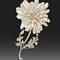 A brooch in the form of a chrysanthemum set with mississippi pearls by tiffany, c.1904.