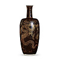 A fine and rare gilt-decorated black-ground 'dragon' vase, qing dynasty, kangxi period