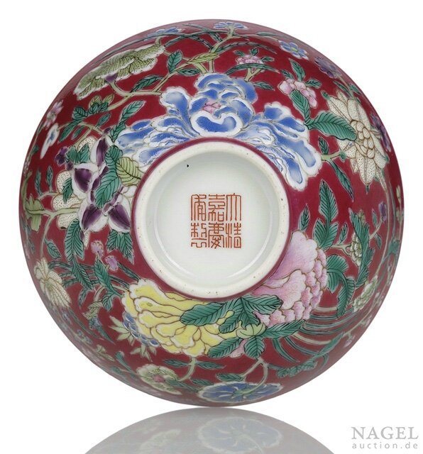 A rare Imperial ruby-ground famille-rose 'floral' bowl, iron-red Jiaqing seal mark and period