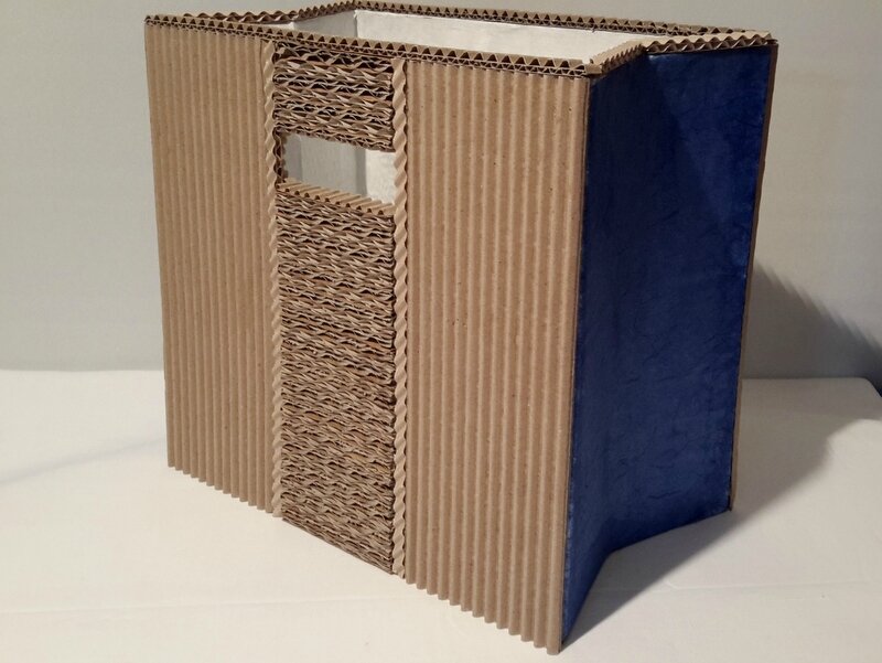portes-revues "dentelle de carton" - an'cartonne