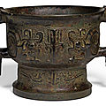 An archaic bronze ritual food vessel and cover, gui, western zhou dynasty (1050-771 bc)