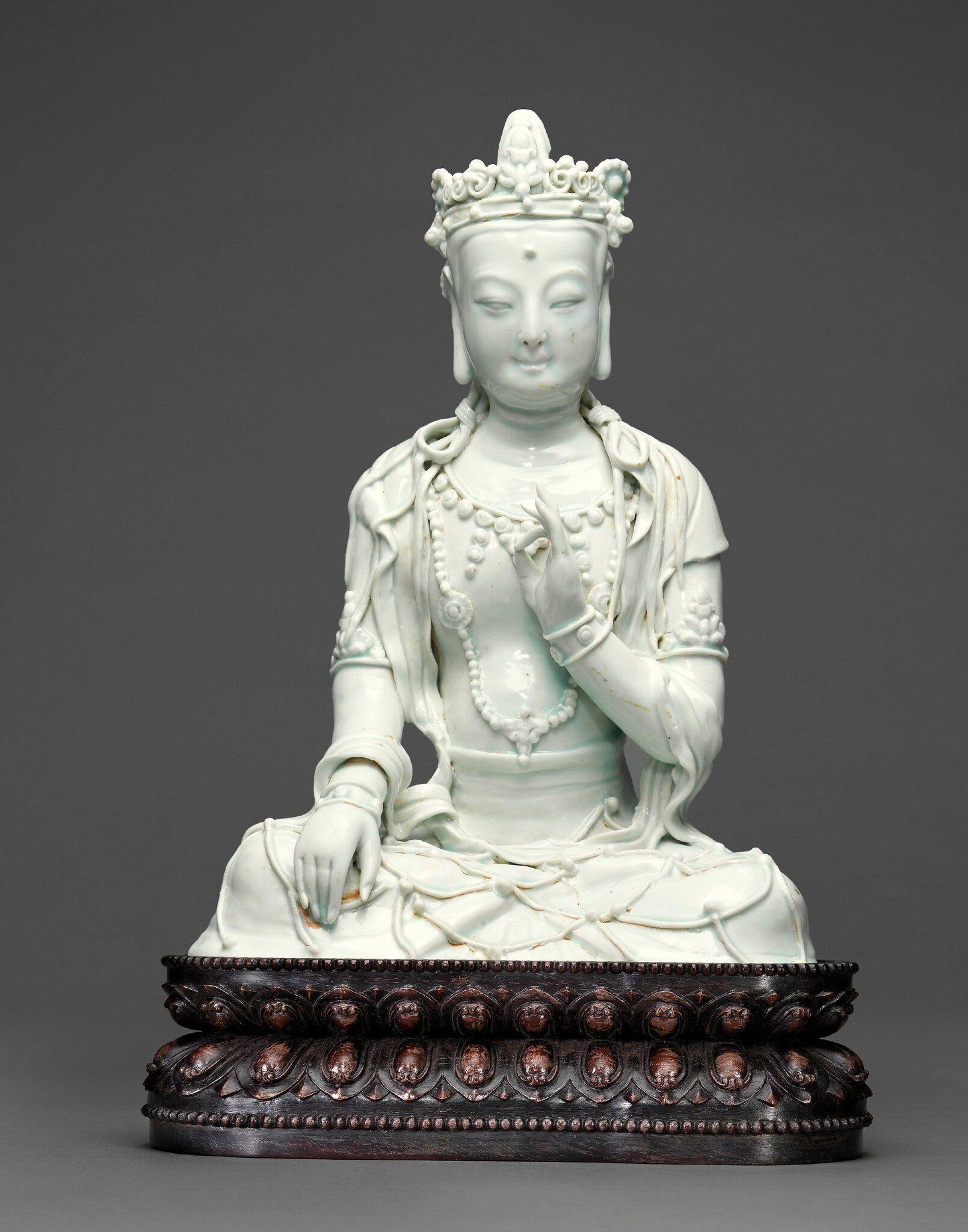 An exceedingly rare Qingbai seated figure of a bodhisattva, Yuan dynasty (1279-1368)