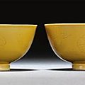 A pair of incised yellow-glazed bowls. qianlong seal marks and period