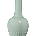 A rare celadon-glazed 'chrysanthemum' bottle vase, kangxi mark and period (1662-1722)