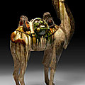A rare and massive sancai-glazed pottery figure of a bactrian camel, tang dynasty (ad 618-907)