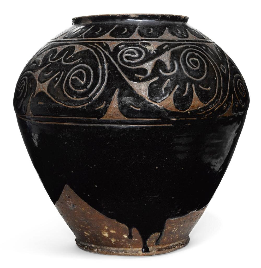 A carved 'Cizhou' 'floral' jar, Yuan-Ming dynasty (1279-1644)
