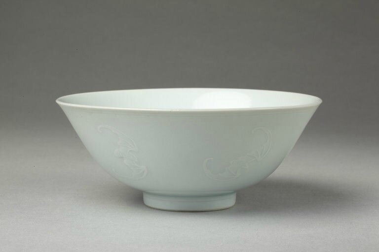 Bowl, porcelain with slip relief designs under a pale bluish glaze, China, Qing dynasty, Yongzheng mark and period (1723-1735)