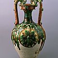 Three-color glazed vase with dragon handles and applied medallions, tang dynasty, 8th century