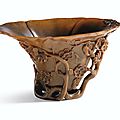 A carved rhinoceros horn 'Prunus' cup, Qing dynasty, 18th century