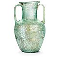A roman two-handled blue-green glass amphora signed by ennion, circa first half of the 1st century a.d.