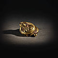 A very rare gilt-bronze 'mythical beast' weight, han dynasty (206 bc-ad 220)