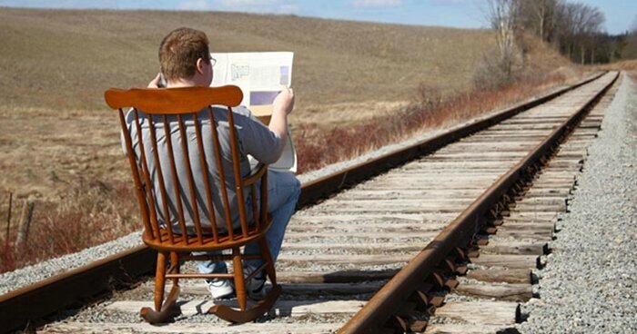 man-rocking-chair-train-track