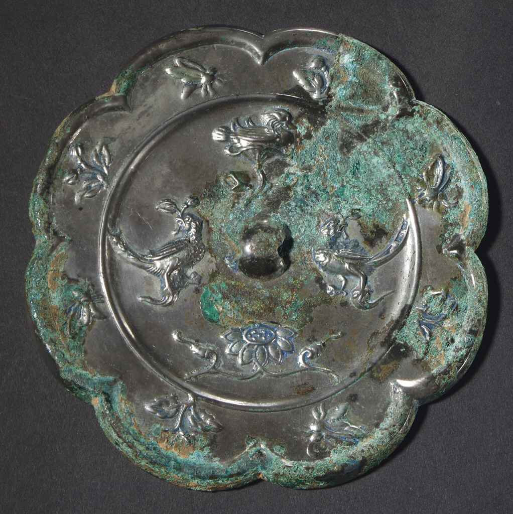 A silvery grey bronze eight-lobed mirror, Tang dynasty (618-907)