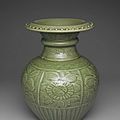 A rare longquan celadon-glazed carved and moulded pomegranate-form vase, shiliu zun, early ming dynasty, 14th-15th century