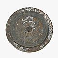 A large Chinese silvery bronze circular mirror, Han dynasty
