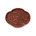 A rare carved cinnabar lacquer oval lobed dish, yuan dynasty (1279-1368)