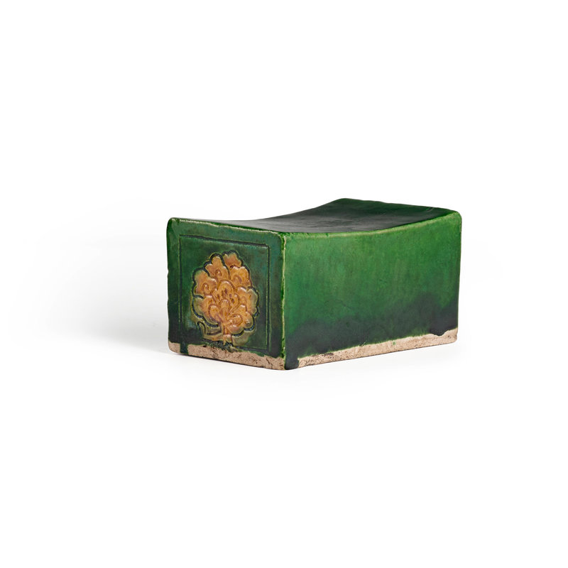 A small rectangular green- and ochre-glazed stoneware wrist rest, Tang Dynasty (618-907)