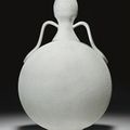 A ming-style white-glazed incised moonflask