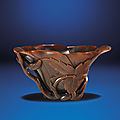 A carved rhinoceros horn floral-form libation cup, Qing dynasty, 18th century