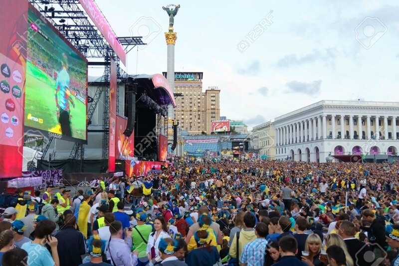 14143536-KIEV-UKRAINE-JUNE-15-Ukrainian-Swedish-and-English-fans-in-the-fanzone-before-match-Euro-2012-betwee-Stock-Photo