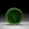A green and amber-glazed pottery tripod offering dish, Tang dynasty (618-907)