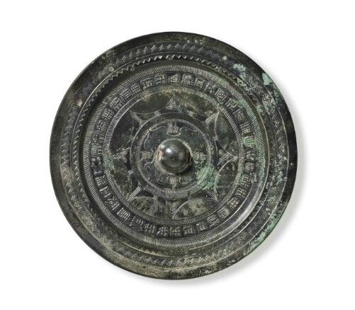 A bronze circular mirror with inscription, China, Late Western-Early Eastern Han Dynasty, 1st Century BC-1st Century AD