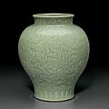 A rare relief-decorated celadon-glazed baluster vase, qianlong six-character seal mark and of the period (1736-1795)