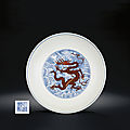 A blue and white and iron-red 'dragon' dish, qianlong six-character sealmark and of the period (1736-1995)