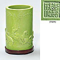 A lime-green-glazed carved cylindrical brushpot, 19th century