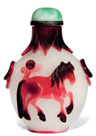 A red glass overlay 'Horse and Monkey' snuff bottle, Qing dynasty (1644-1911)