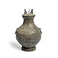 An archaic bronze ritual wine vessel and cover, hu, han dynasty