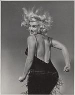 1959-10-NY-Jump_sitting-black_dress-by_halsman-034-1