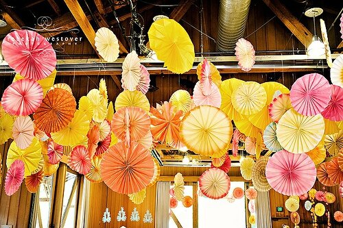 yellow-pink-orange-colorful-wedding-recipetion-decor-paper-pinwheels