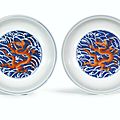 A pair of fine blue and white and iron-red 'dragon' dishes, seal marks and period of qianlong (1736-1795)