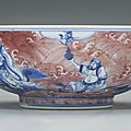 An underglaze blue and copper-red 'immortals' bowl, qianlong six-character seal mark in underglaze blue and of the period