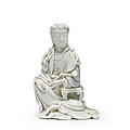 A blanc de chine seated figure of guanyin, 17th century