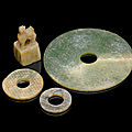 Three green and russet jade bi discs, han dynasty or later 