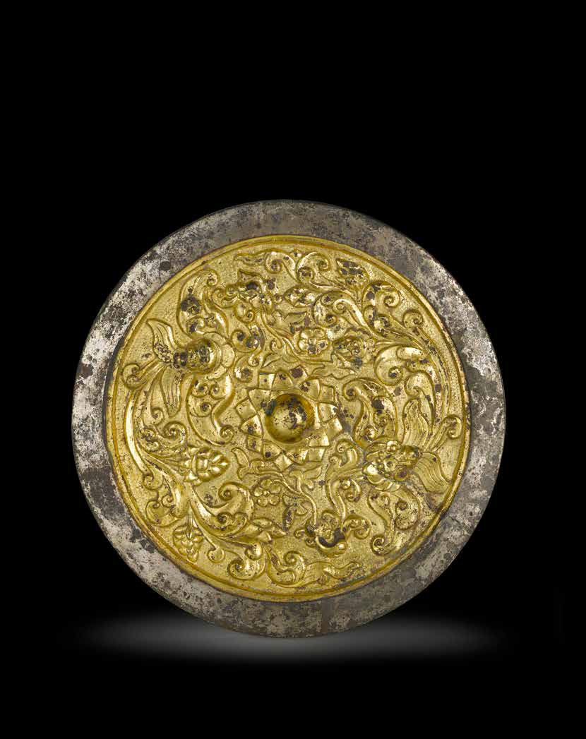 A rare gold overlay silvered bronze mirror, 9th-13th century