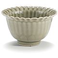 An incised celadon-glazed cup, qing dynasty, kangxi period (1662-1722)