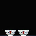 A fine pair of iron-red and underglaze-blue bowls, qianlong six-character sealmarks and of the period (1736-1795)